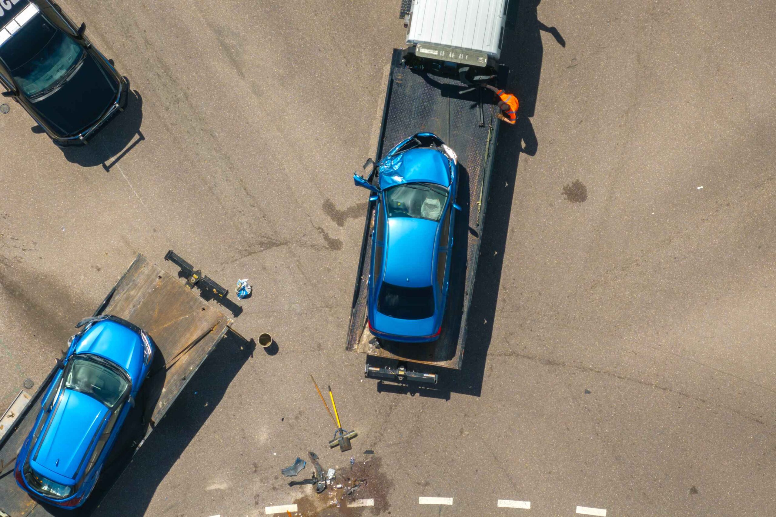 car after accident moving by truck