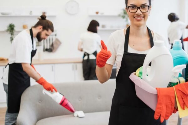 Professional cleaning team using eco-friendly products during House Clean Out Services Kent WA, preparing a living space for a fresh start.